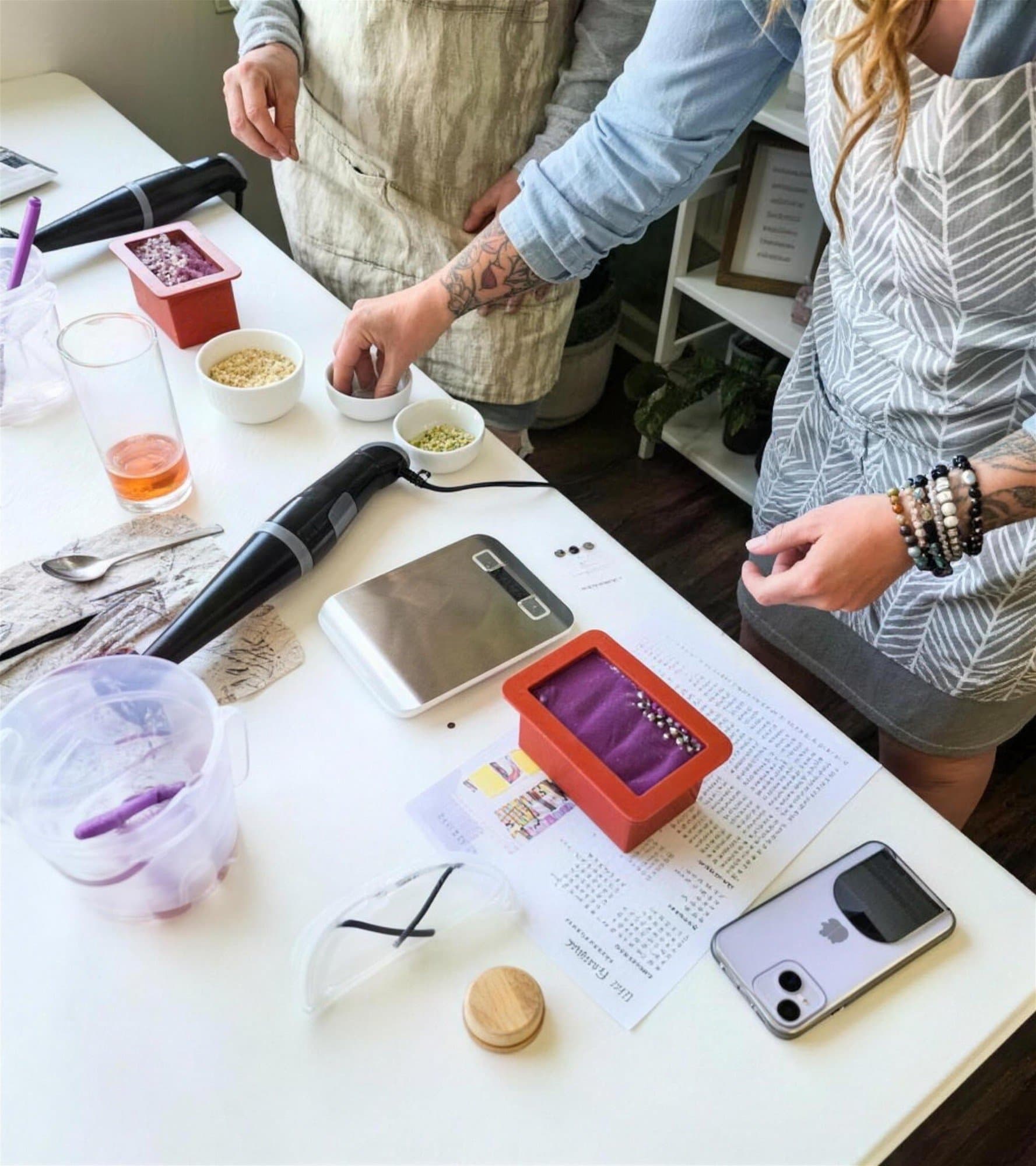 Measuring ingredients and pouring soap during a soap-making workshop
